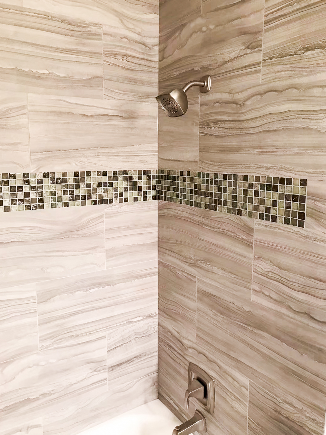 A large wood tiled shower